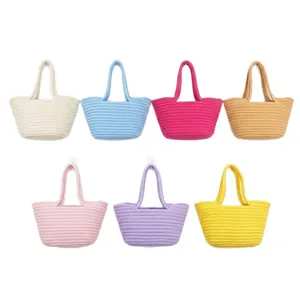 Set of seven colorful hand-woven cotton rope tote bags in various vibrant shades