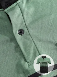 Close-up of green men's polo shirt showing black button placket and fabric texture.