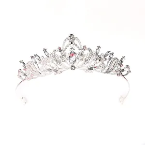 Close-up detail of an elegant silver Baroque wedding tiara with sparkling crystal embellishments