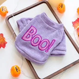 Detail view of purple corduroy Halloween pet sweater with 'Boo!' embroidery decoration
