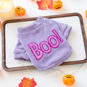 Close-up detail of purple corduroy Halloween pet sweater featuring pink glitter Boo embroidery