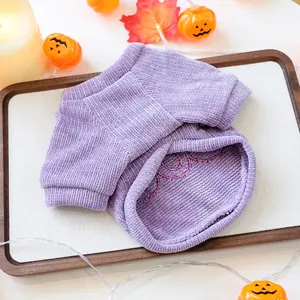 Detail view of purple corduroy pet Halloween sweater with delicate interior embroidery