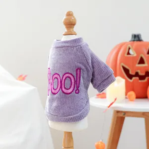 Detailed side view of purple corduroy pet sweater with pink BOO! embroidery