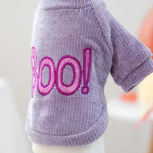 Close-up of purple corduroy pet sweater with pink glittery BOO! embroidery for Halloween