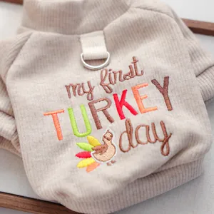 Detail of pet ribbed sweater with 'my first TURKEY day' colorful embroidery and D-ring