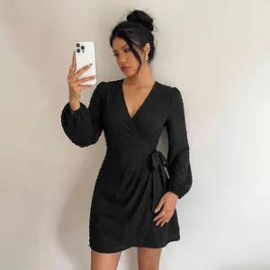 Elegant black V-neck long sleeve mini wrap dress with Swiss dot texture for women's fashion