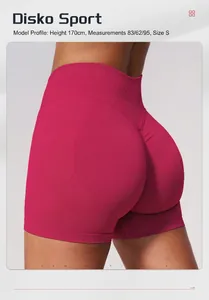 Detail view of pink seamless high-waist yoga shorts showing the compression lifting fit