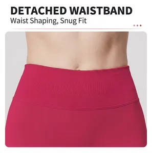 Detailed view of pink high-waisted yoga shorts with a seamless wide elastic waistband