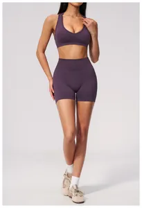 Professional model wearing purple seamless high-waisted yoga shorts for gym fitness