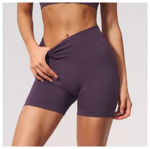 Close-up detail of women's seamless high-waisted yoga shorts in deep purple for fitness