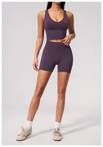 Seamless high-waisted purple gym yoga shorts set for women's fitness and running.