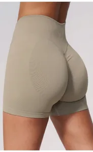 Back view of seamless high-waist yoga shorts in terracotta with scrunch butt detail
