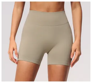 Detail view of seamless high-waist yoga shorts in khaki with supportive ribbed waistband