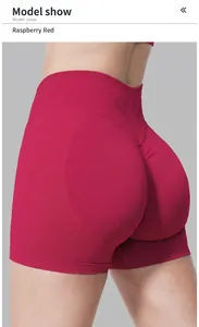Close-up of raspberry red seamless high-waisted yoga shorts with butt-lifting design.