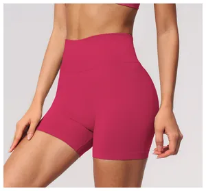 Detailed view of rose red seamless high-waist yoga shorts with ribbed waistband