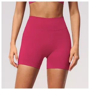 Detailed view of pink high-waisted seamless yoga shorts designed for fitness and running.