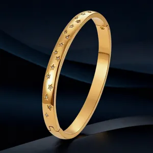 Detail shot of 18K gold plated stainless steel bangle with star-shaped cubic zirconia