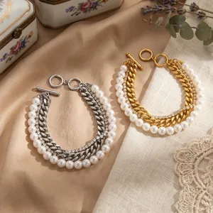 Close-up of gold and silver multi-layer zircon pearl bracelets with OT clasps.