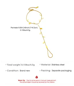 Detailed view of gold stainless steel finger bracelet with leaf charms and size info