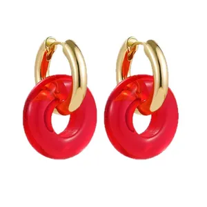 Elegant French style stainless steel hoop earrings featuring translucent red resin donut charms