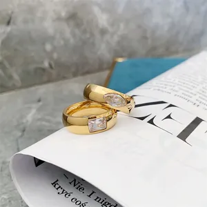 Detailed view of vintage gold stainless steel rings with square and marquise zircons