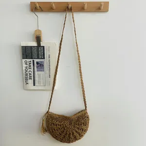 Handmade woven straw crossbody bag with tassel for summer beach vacation styling