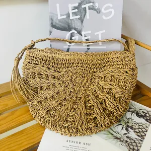 Stylish handmade paper rope woven straw crossbody bag with decorative tassel for beach vacation