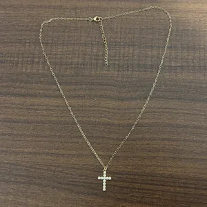 Exquisite 18K gold plated stainless steel necklace featuring a micro-paved CZ cross pendant