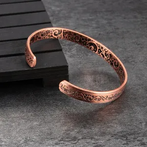 Adjustable pure copper magnetic cuff bracelet with intricate arabesque vine engravings