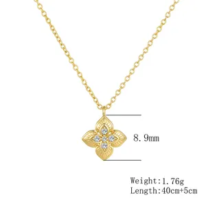 Detailed view of gold plated four-leaf clover pendant necklace featuring sparkling zircons.