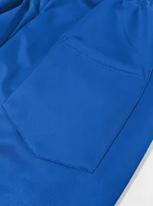 Detailed macro shot of the reinforced back pocket on royal blue quick-dry athletic joggers