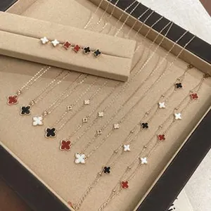 Detailed view of an elegant four-leaf clover jewelry collection including necklaces