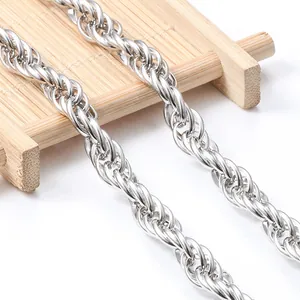 Detailed macro view showing the textured links of a polished silver stainless steel rope chain