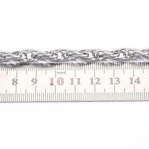 Close-up detail of silver titanium steel twisted rope necklace chain with ruler measurement