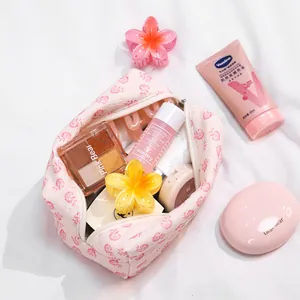 Pink lace jacquard cosmetic storage bag with elegant floral texture for travel organization
