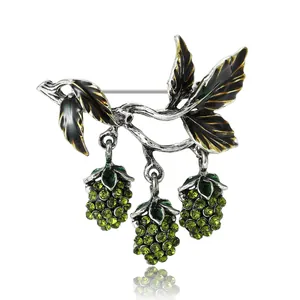Elegant mulberry fruit branch brooch with green rhinestones and black enamel finish