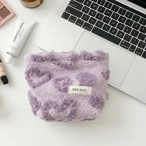 Adorable purple fuzzy makeup bag with heart pattern for portable cosmetic storage travel pouch