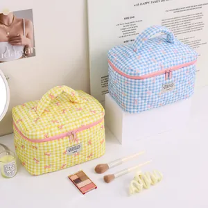 Cute quilted checkered makeup bag with bow pattern for cosmetics and skincare storage
