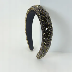 Elegant Baroque sponge headband encrusted with black rhinestones and gold settings.