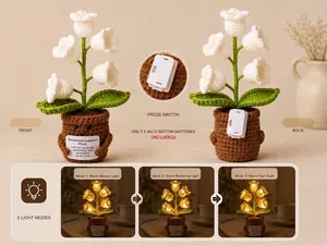 Handmade knitted lily of the valley plant with 3 warm light modes and smiley pot.