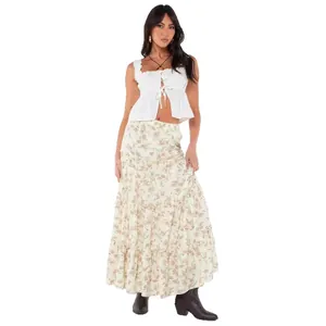 Elegant bohemian floral tiered maxi skirt paired with white ruffle crop top for women