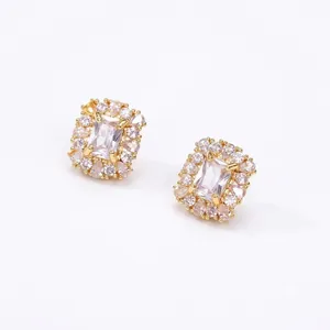 Elegant gold-plated stud earrings with rectangular crystal and halo design for women.
