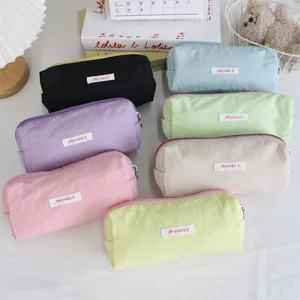 Detailed view of large capacity macaron pencil cases in various pastel colors for students