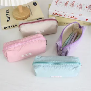 Detail view of macaron colored minimalist pencil cases for student stationery storage