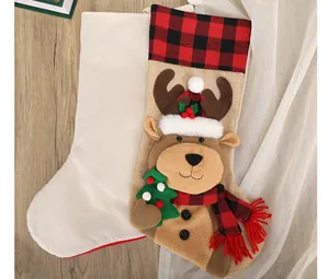 Close-up of burlap Christmas stocking with 3D reindeer and red plaid scarf decor