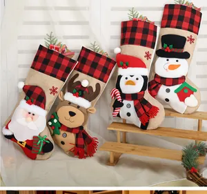 Set of four burlap Christmas stockings with Santa, Reindeer, Penguin and Snowman motifs