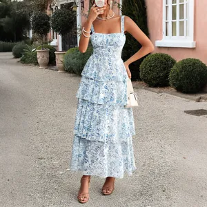 Elegant blue and white floral tiered chiffon midi dress with spaghetti straps for summer