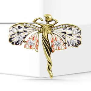 Vintage gold alloy angel brooch with enamel butterfly wings and sparkling crystal accents