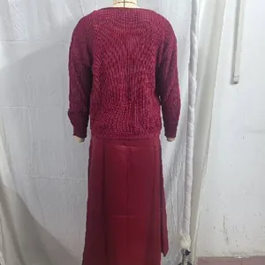 Back view of burgundy knit sweater and long satin skirt two-piece set for women