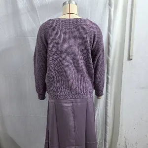Back view of a fashionable purple knitted sweater and satin skirt two-piece outfit set.